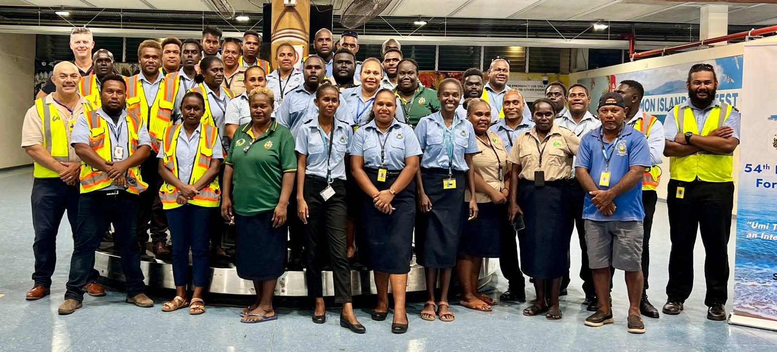 SICED staff and partner agencies at a training session at Honiara airport